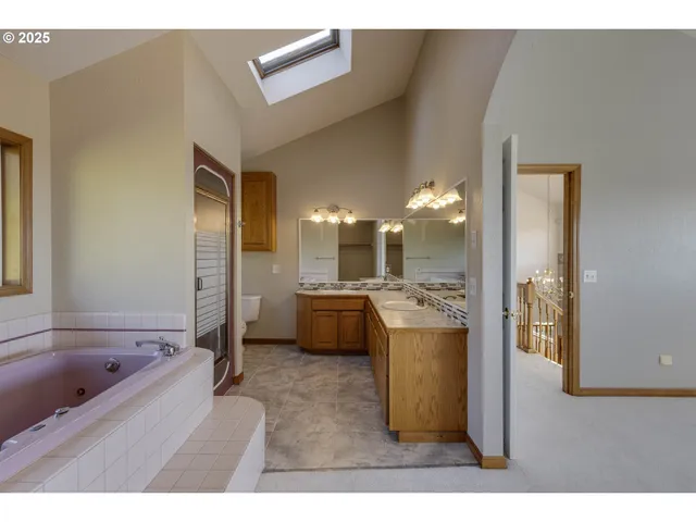 a kitchen with a refrigerator and a sink