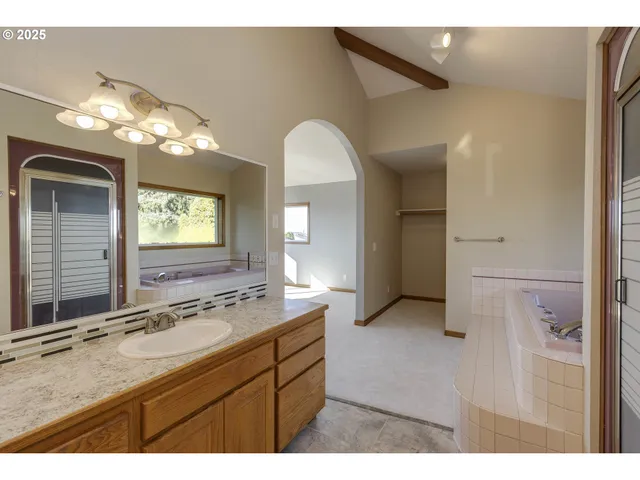 a bathroom with a double vanity sink and a mirror