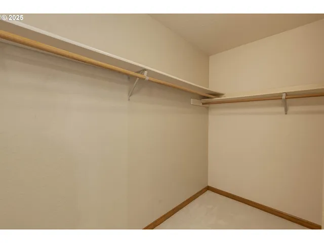 a view of an empty walk in closet