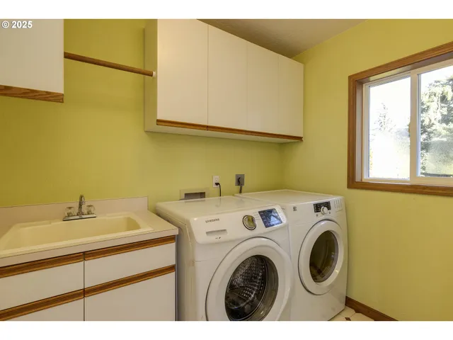 a utility room with dryer and washer
