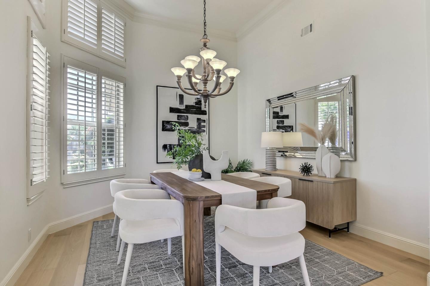 20455 Franklin Avenue Saratoga, CA 95070 - Photo 16 of 44 a dining room with furniture a chandelier and wooden floor