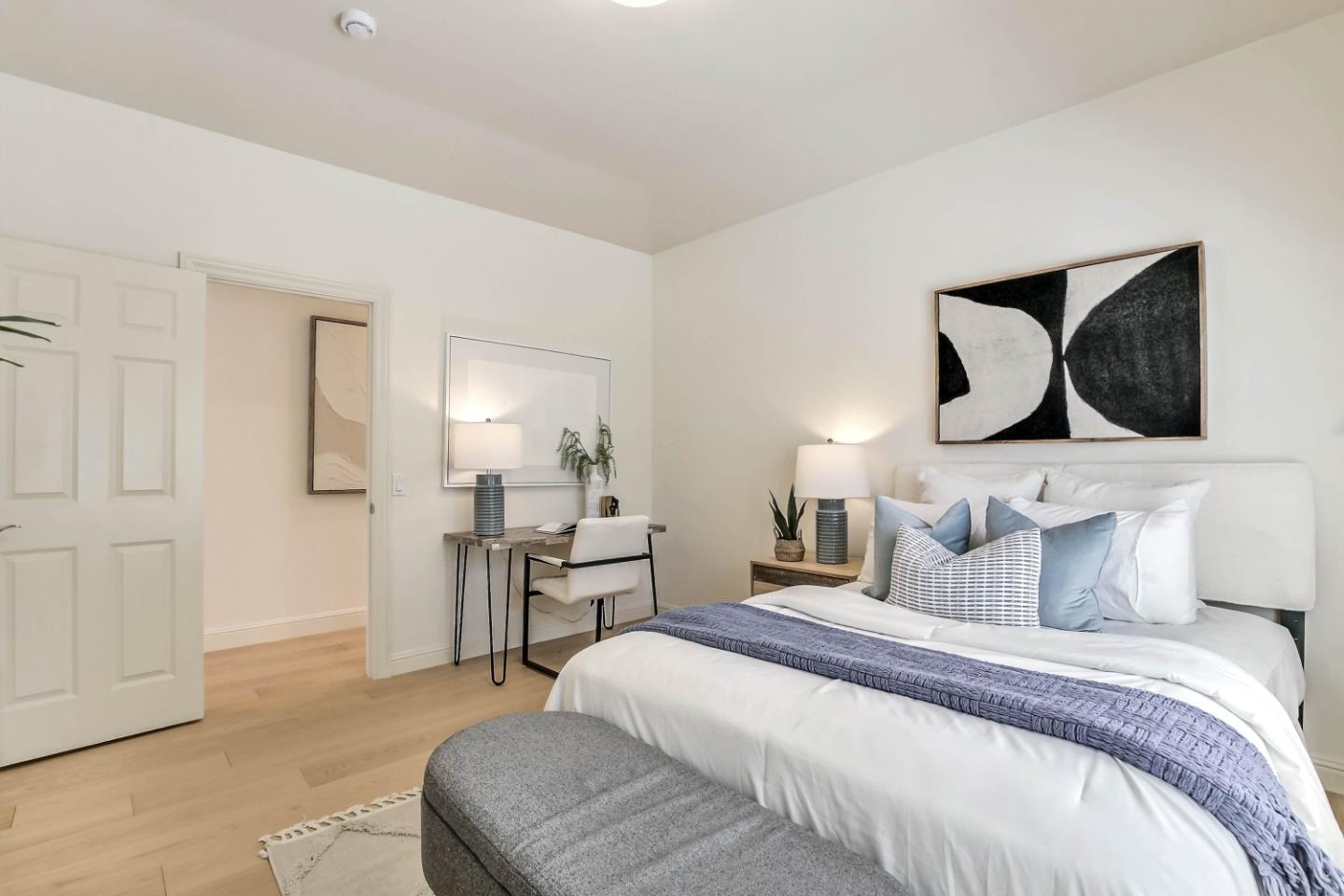 20455 Franklin Avenue Saratoga, CA 95070 - Photo 23 of 44 a bedroom with a bed and lamp