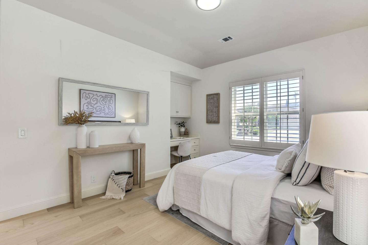 20455 Franklin Avenue Saratoga, CA 95070 - Photo 25 of 44 a bedroom with a bed and a table in it