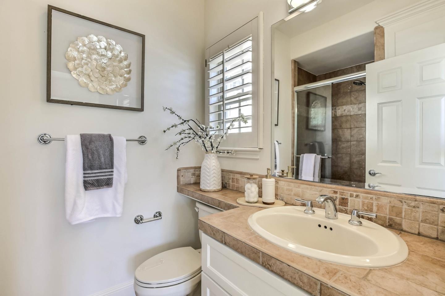 20455 Franklin Avenue Saratoga, CA 95070 - Photo 30 of 44 a bathroom with a toilet sink and mirror
