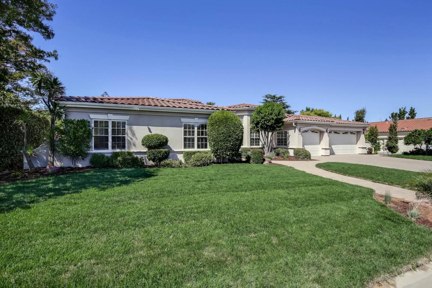 20455 Franklin Avenue Saratoga, CA 95070 - Photo 3 of 44 a view of a house with backyard sitting area and garden