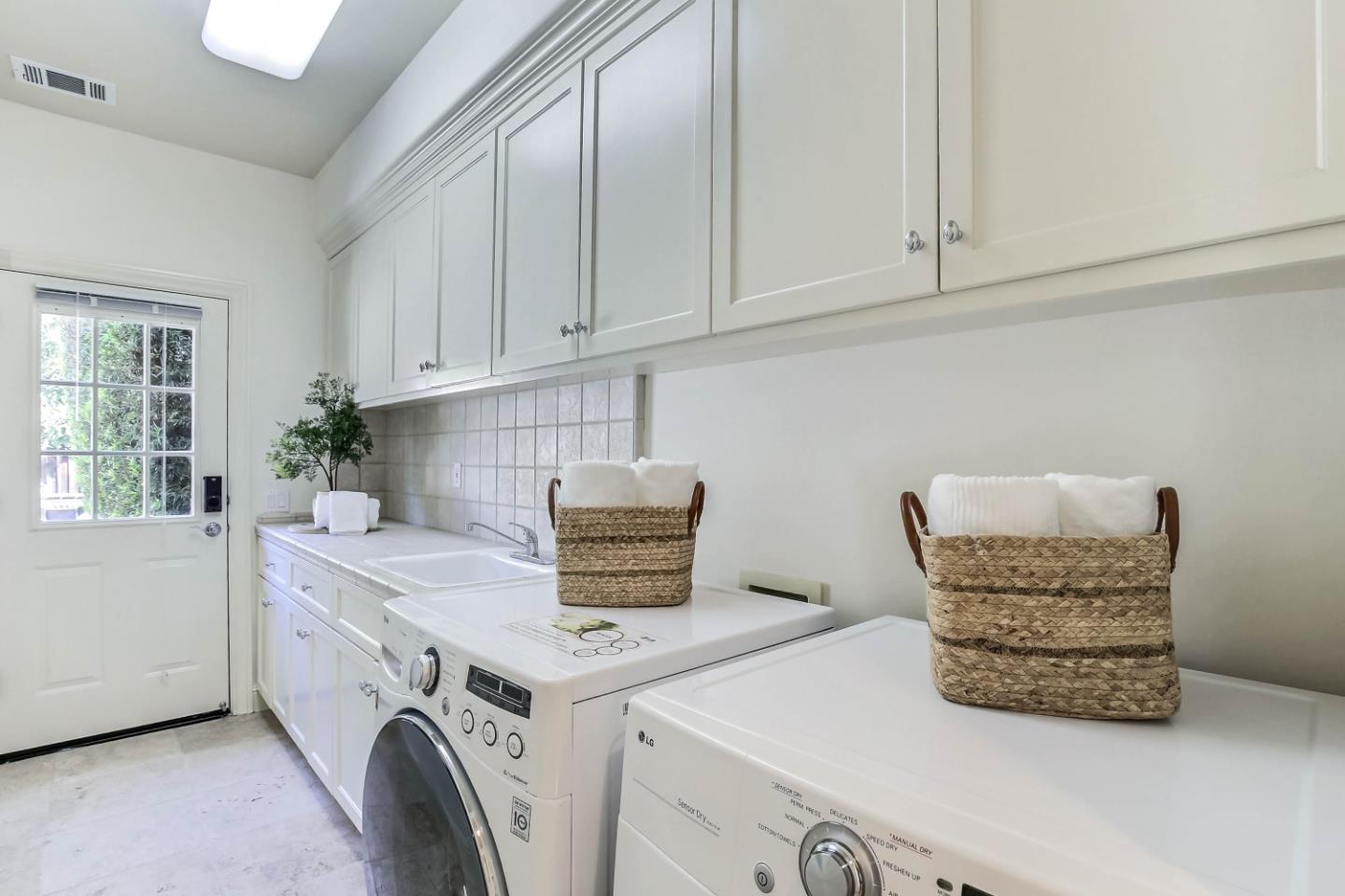 20455 Franklin Avenue Saratoga, CA 95070 - Photo 33 of 44 a utility room with dryer and washer
