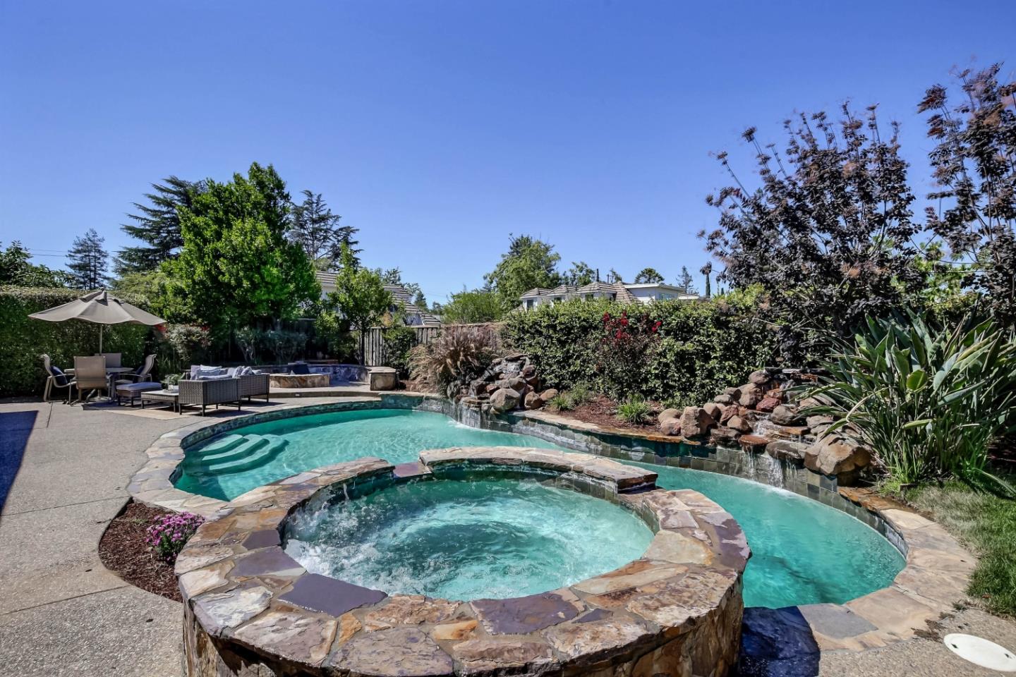20455 Franklin Avenue Saratoga, CA 95070 - Photo 41 of 44 a view of a swimming pool with a patio