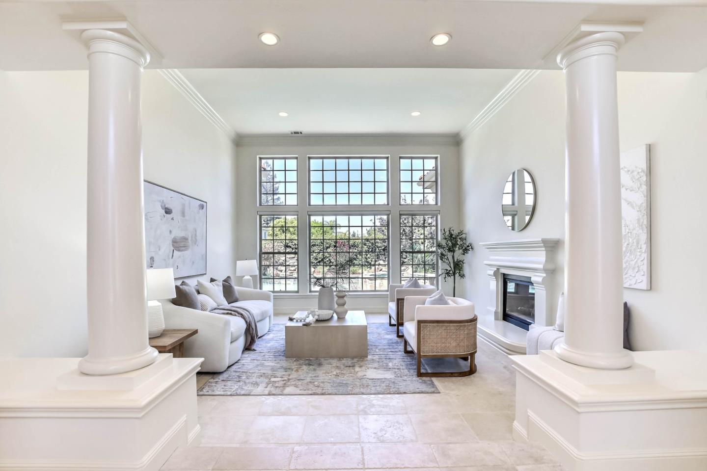 20455 Franklin Avenue Saratoga, CA 95070 - Photo 5 of 44 a living room with fireplace furniture and a large window