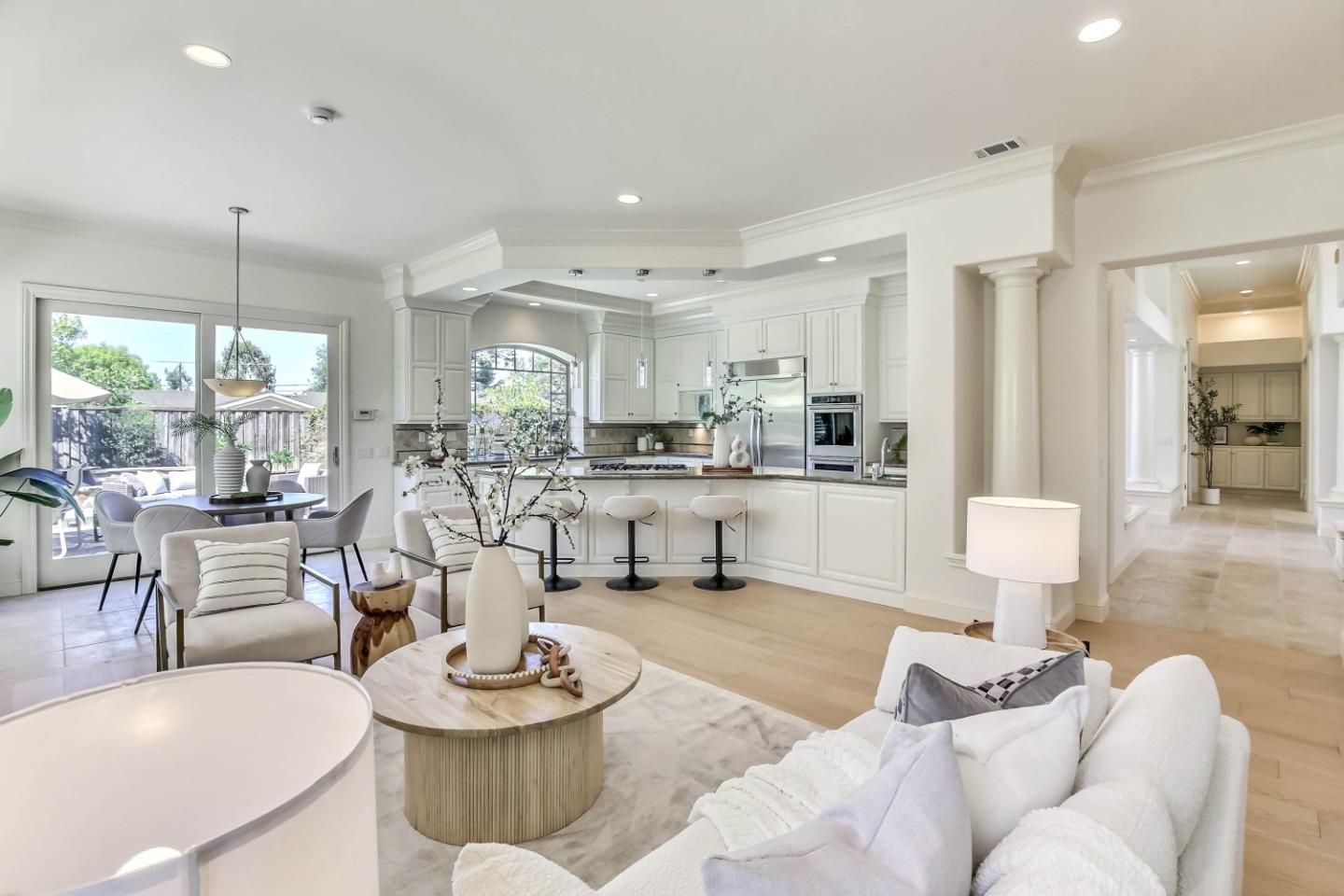20455 Franklin Avenue Saratoga, CA 95070 - Photo 9 of 44 a living room with stainless steel appliances couches a dining table and chairs