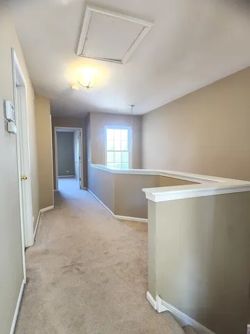 an empty room with windows and entrance