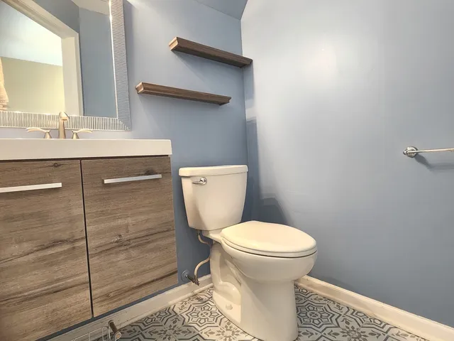 a bathroom with a toilet and a sink