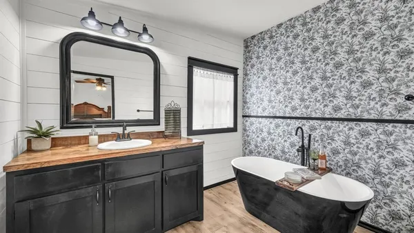 a bathroom with a sink and a mirror