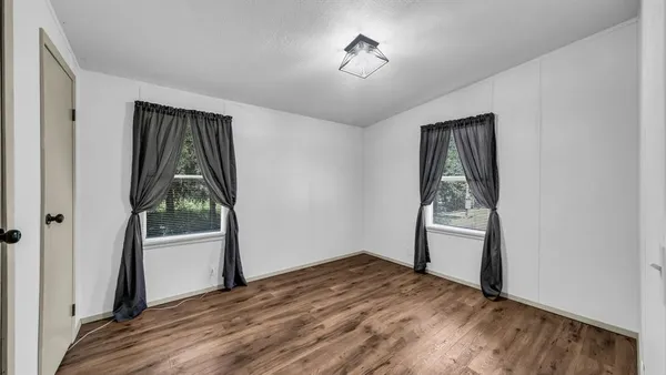 an empty room with windows