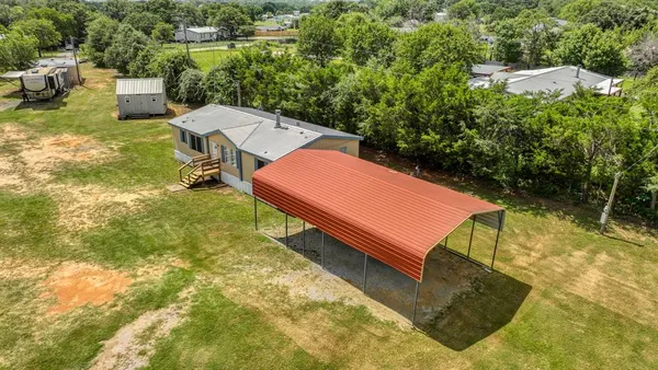 a view of a swimming pool with a patio