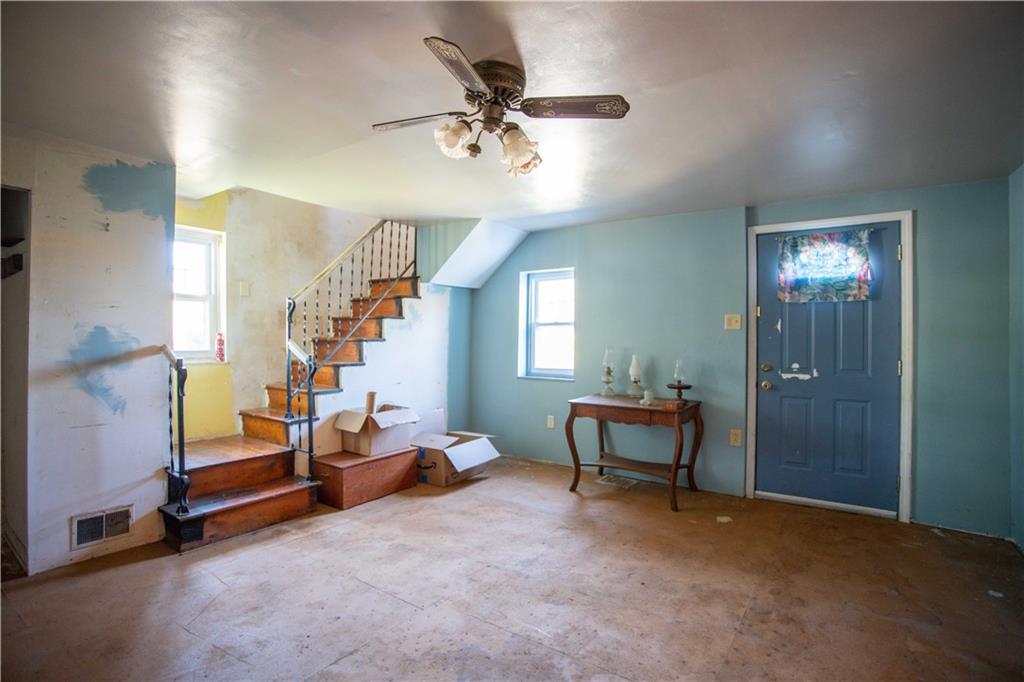1698 Old Brodhead Road Monaca, PA 15061 - Photo 12 of 34 a living room with furniture and a chandelier