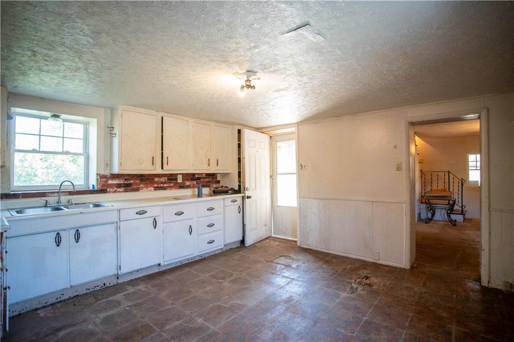 1698 Old Brodhead Road Monaca, PA 15061 - Photo 2 of 34 a spacious bathroom with a granite countertop sink and a mirror