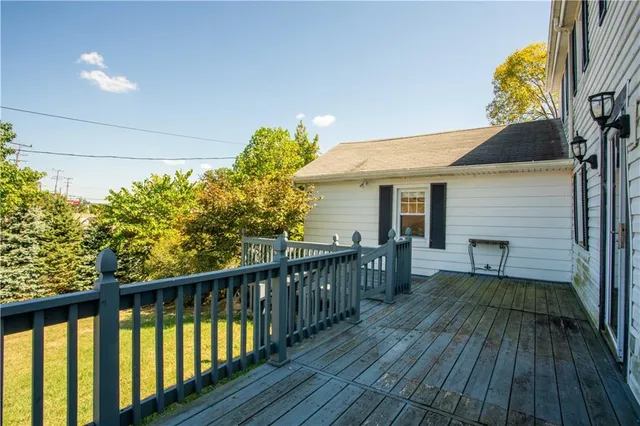 a view of a balcony with wooden floor