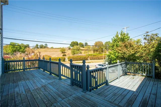 a view of a porch with wooden floor