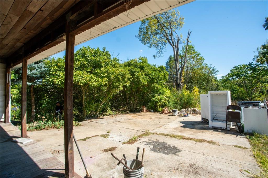 1698 Old Brodhead Road Monaca, PA 15061 - Photo 30 of 34 a patio with table and chairs and potted plants