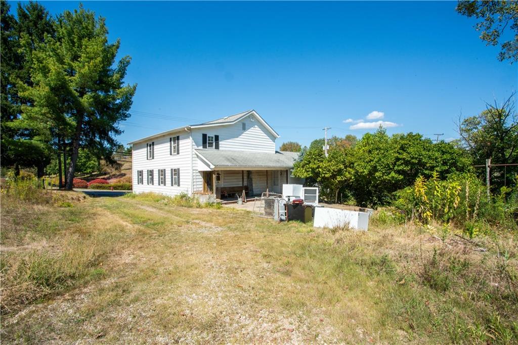 1698 Old Brodhead Road Monaca, PA 15061 - Photo 32 of 34 a front view of a house with a yard and garage