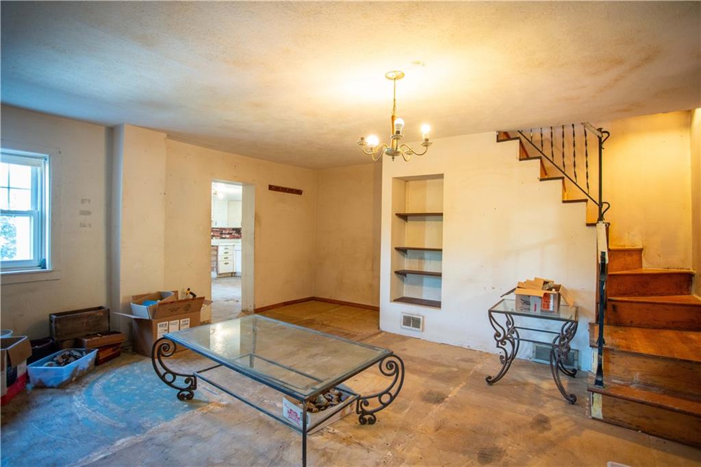 1698 Old Brodhead Road Monaca, PA 15061 - Photo 9 of 34 a living room with furniture a dining table and a piano