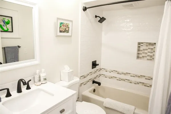 a living room with a bed furniture and a window