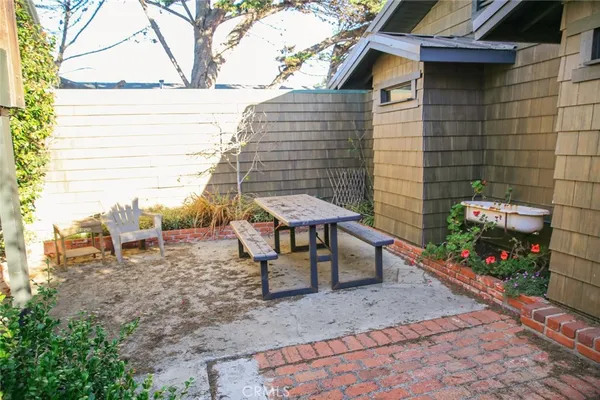 a kitchen with stainless steel appliances kitchen island granite countertop a sink and a stove