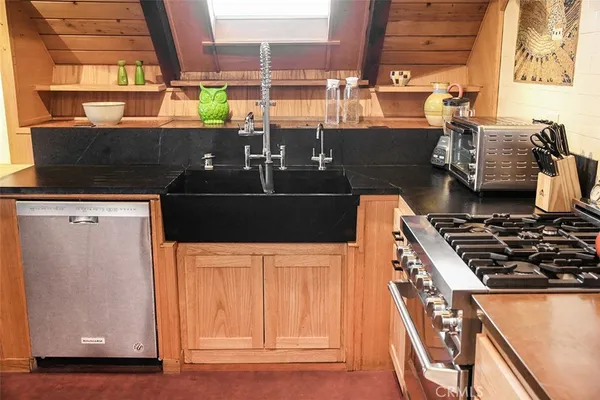 a kitchen with stainless steel appliances a stove and a refrigerator
