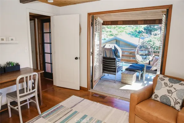 a bedroom with a bed and a potted plant