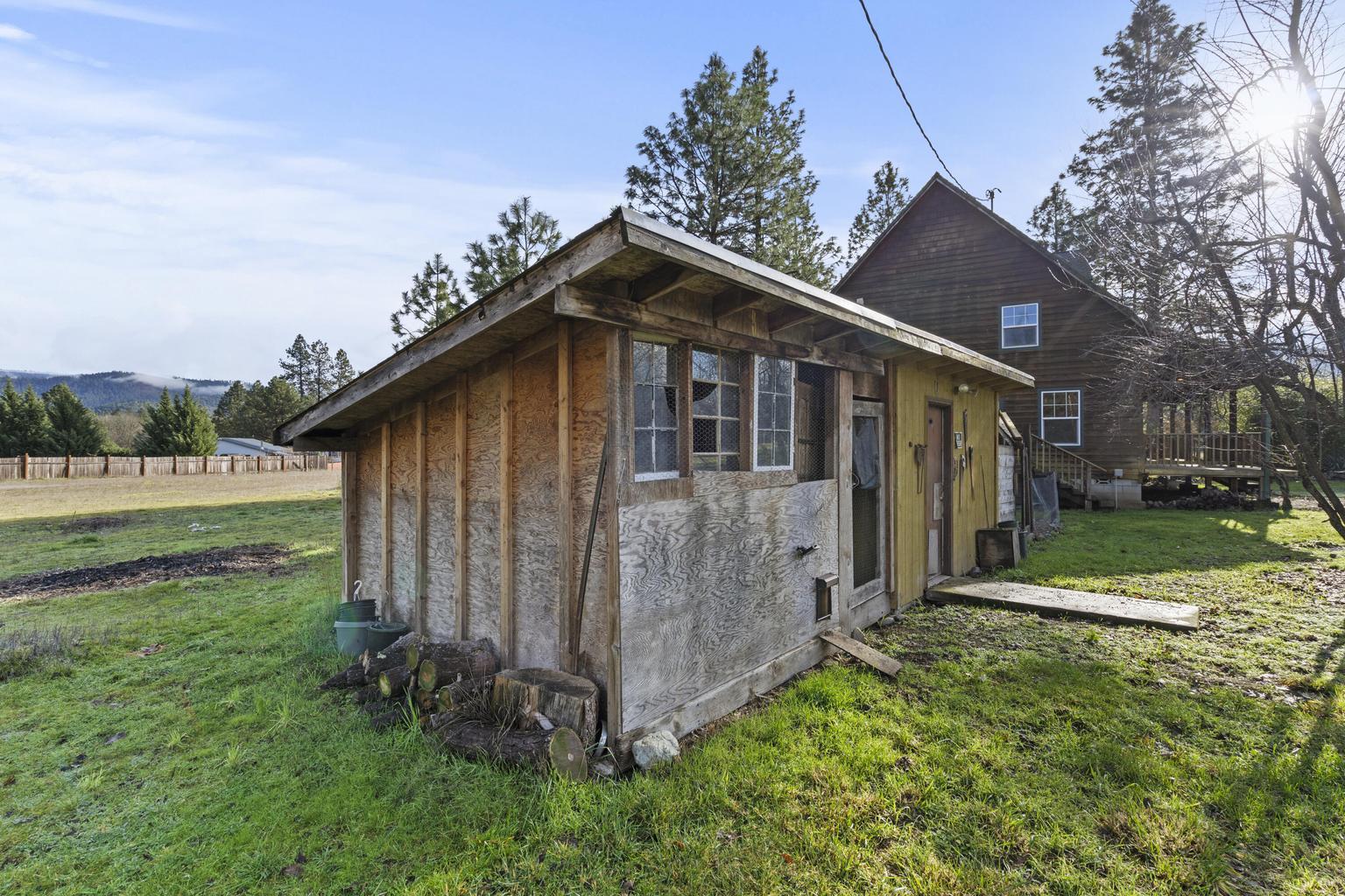 1190 Cedar Flat Road Williams, OR 97544 - Photo 43 of 45 a front view of a house with garden