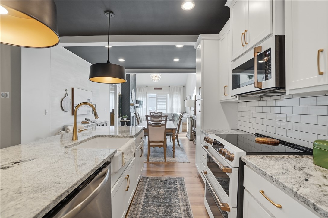 605 Cape Cod Court Beavercreek, OH 45430 - Photo 15 of 54 This modern kitchen features elegant countertops and a convenient open-concept design.