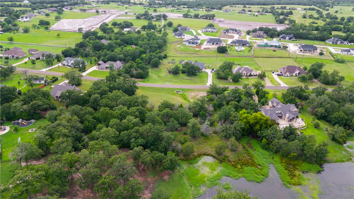 6922 McCrae Lane Bryan, TX 77808 - Photo 7 of 18 a view of a lake with a city