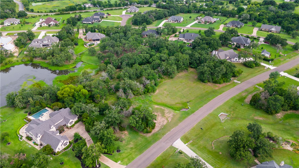 6922 McCrae Lane Bryan, TX 77808 - Photo 9 of 18 an aerial view of residential houses with outdoor space and street view