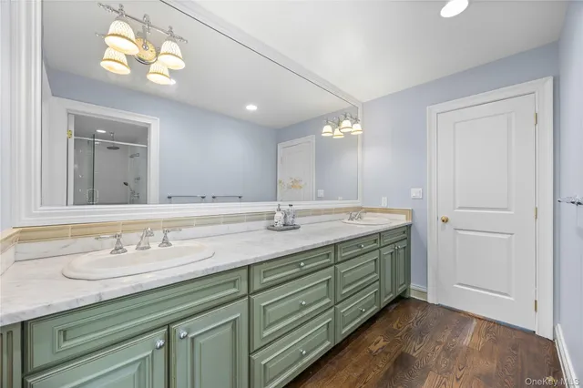 a bathroom with a shower and a bath tub