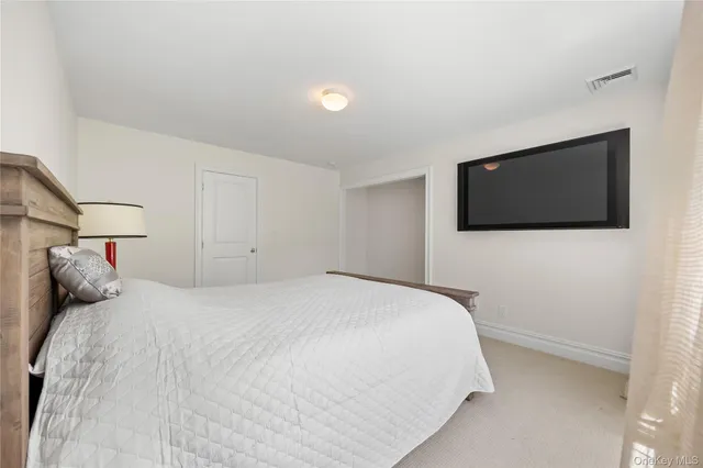 a bed room with a bed and a window