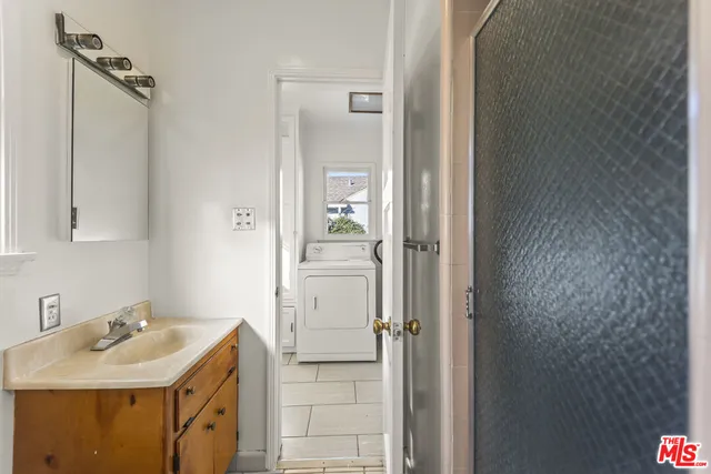 a bathroom with a sink and mirror
