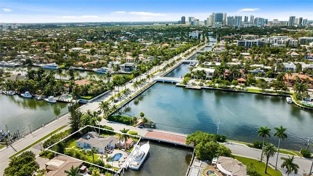 an aerial view of a house with a lake view