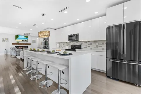 a kitchen with counter top space cabinets and stainless steel appliances
