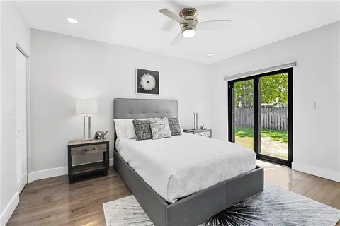 a bedroom with a large bed and a window