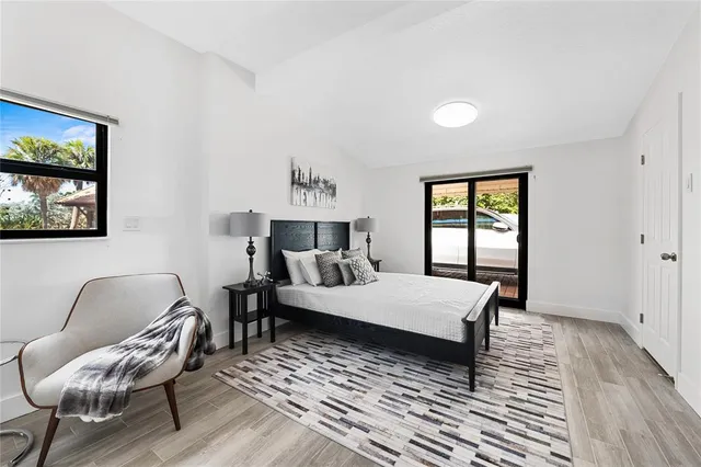 a bedroom with a bed and a chair