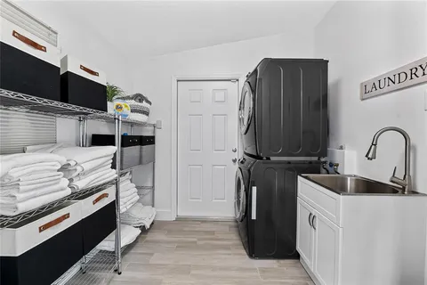a kitchen with stainless steel appliances a stove refrigerator and cabinets