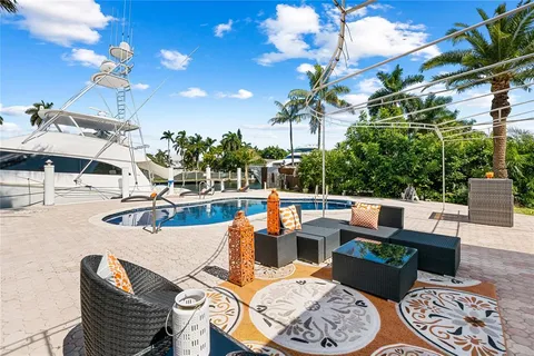 a outdoor space with patio the couches and a potted plant on the table