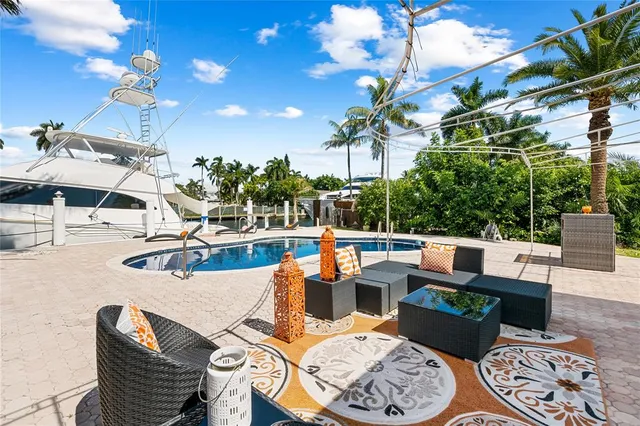 a outdoor space with patio the couches and a potted plant on the table