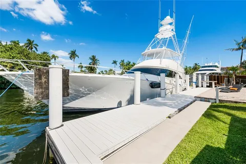 a view of a patio with table and chairs a barbeque and potted plants