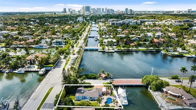 an aerial view of a house with a lake view
