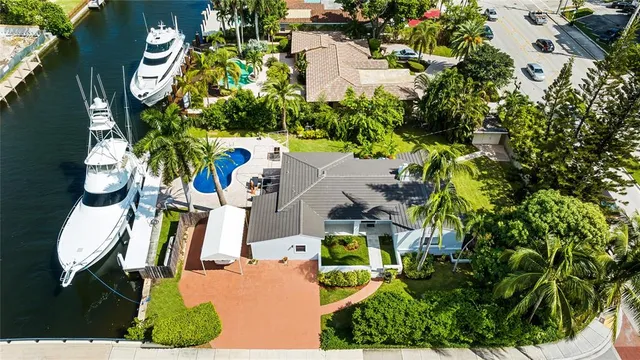 an aerial view of residential house with outdoor space and swimming pool