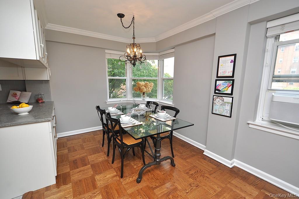 235 Garth Road, Unit E2E Scarsdale, NY 10583 - Photo 44 of 46 The dining area has a bay window and opens to both the living room and renovated kitchen. The dining room is approx 9'-0" x 8'-10"