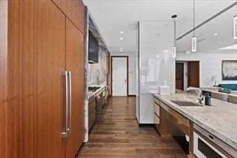 a bathroom with double vanity and a shower
