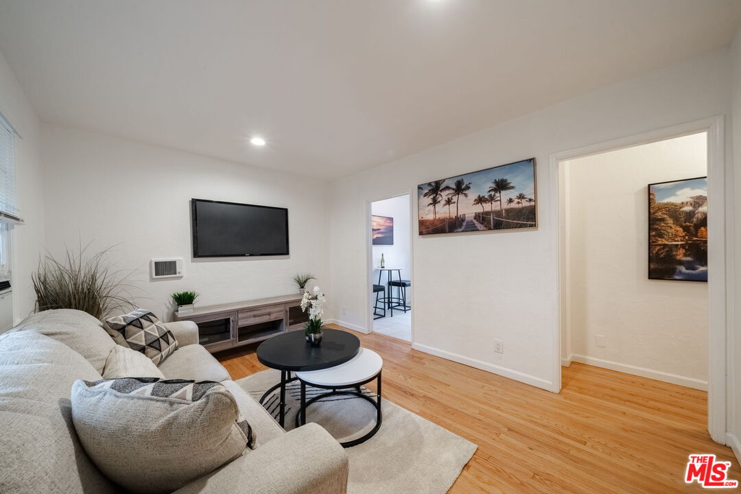 823 Highland Avenue, Unit 2 Glendale, CA 91202 - Photo 4 of 5 a living room with furniture and a flat screen tv