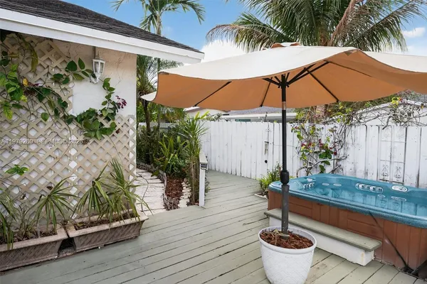 an aerial view of residential houses with outdoor space and street view